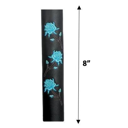 Leather and adorned with three embroidered teal roses